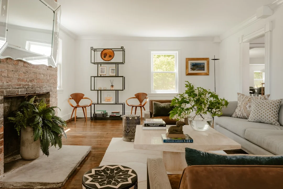 Bright living room with green plants and wooden furniture