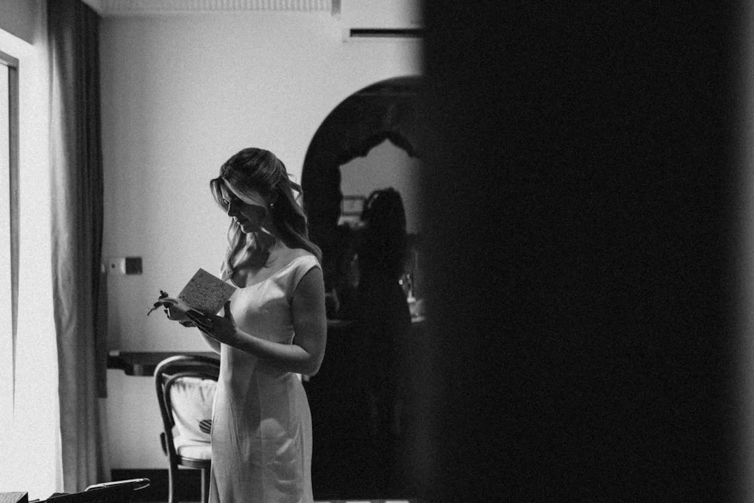 Woman looks calmly in the mirror - symbol of body neutrality instead of forced self-love