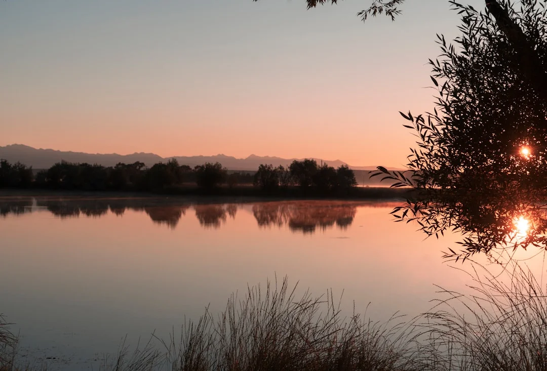 Woman meditating in nature at sunrise as a symbol of inner transformation