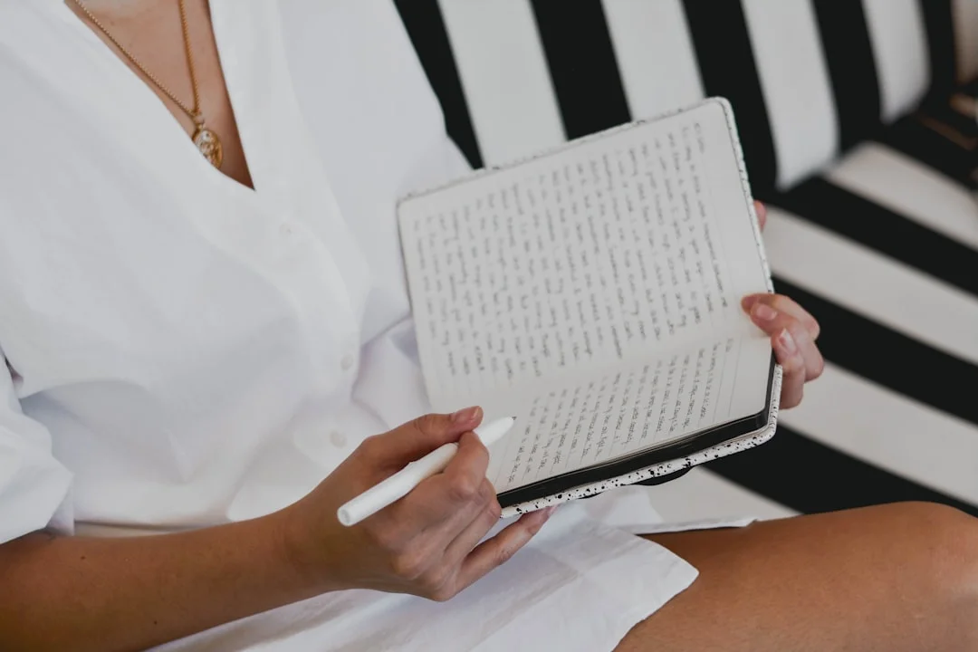 A woman writes in her diary in the morning—an image of mindful self-reflection and inner balance