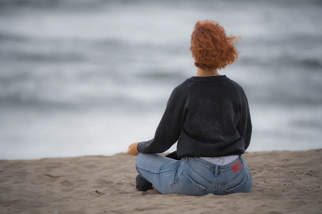 Person in mindful body awareness during a therapy session