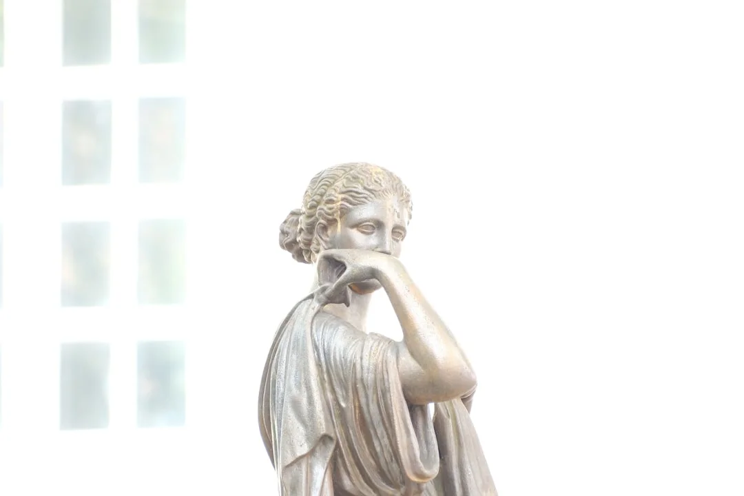Marble bust of an ancient Roman philosopher against a dark background