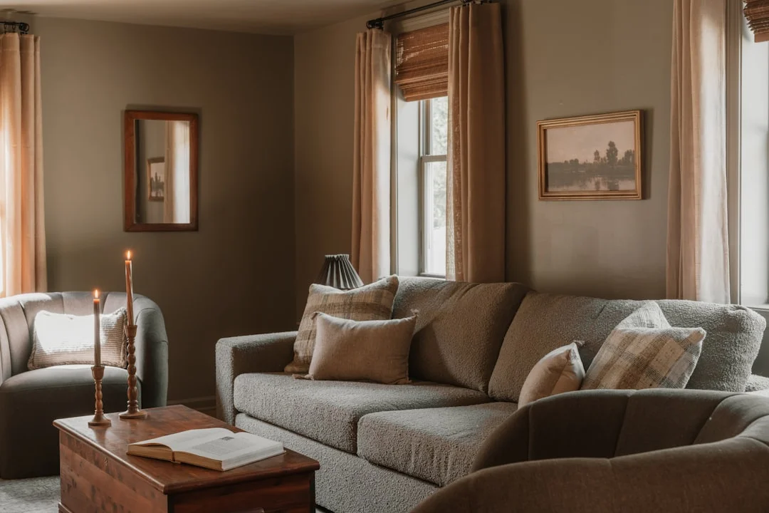 Cozy living room in warm earth tones featuring terracotta and beige