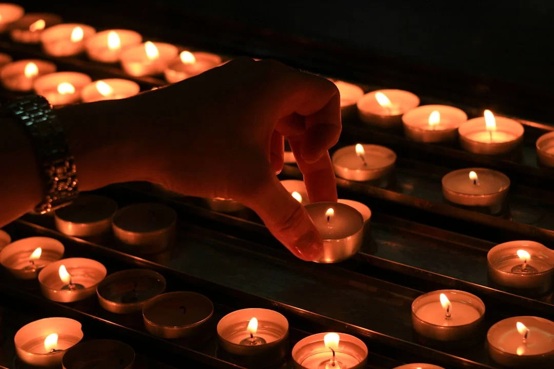 Meditation with candlelight and folded hands