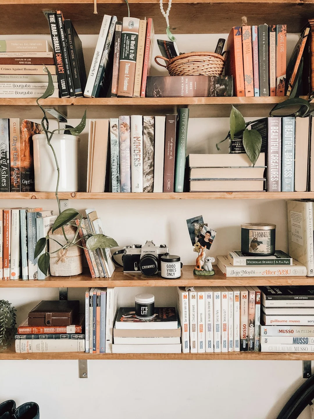 books on a white wooden shelf