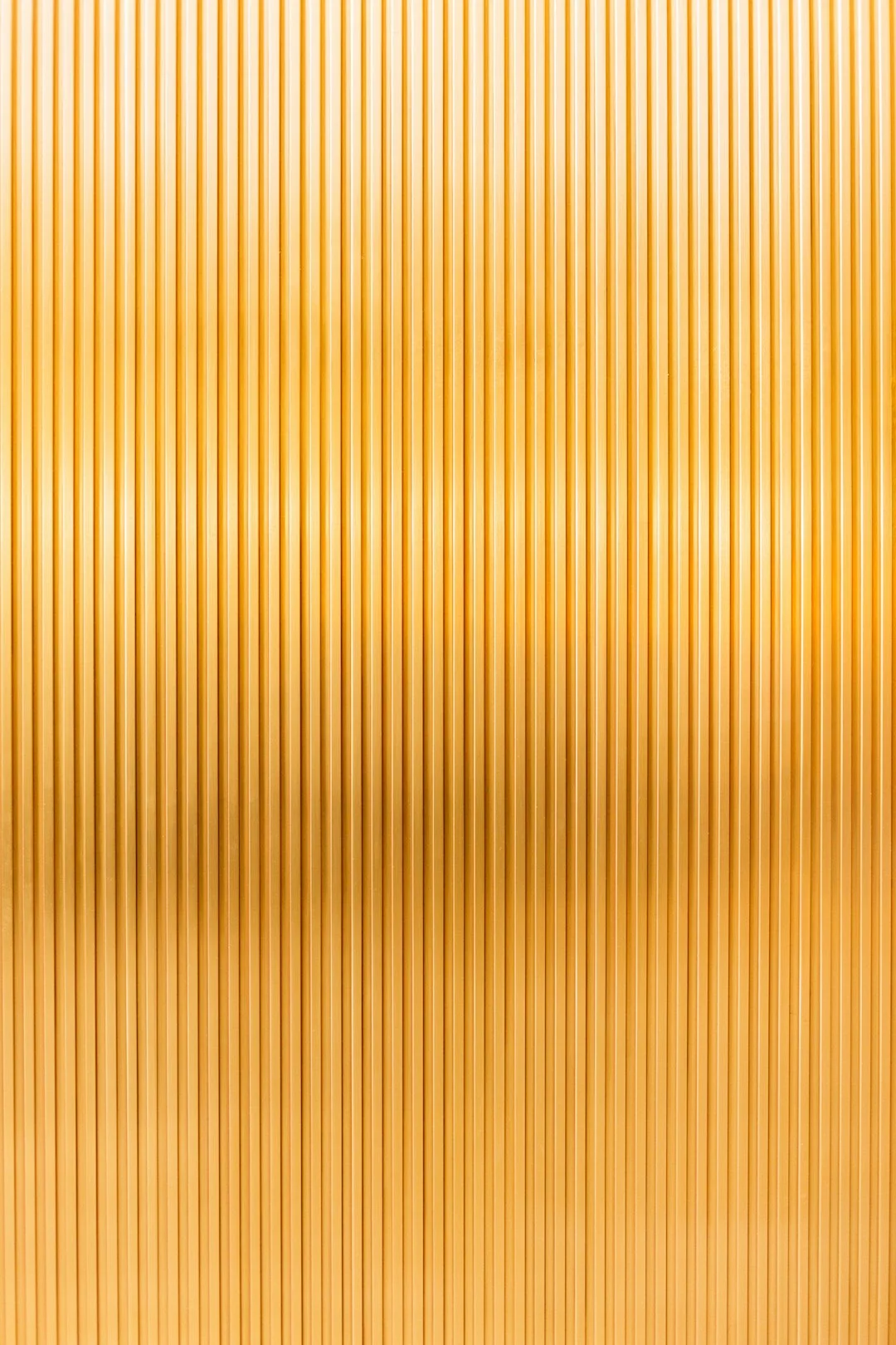 a gold metallic background with vertical lines