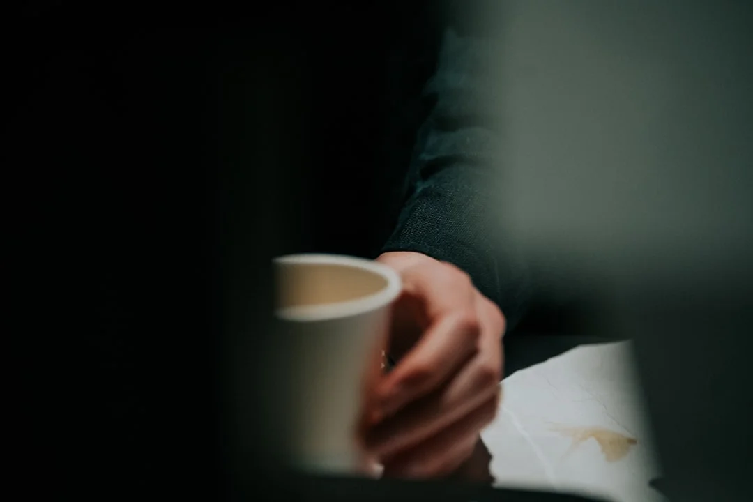 Person enjoying a coffee in the morning - an image of hedonic happiness in everyday life