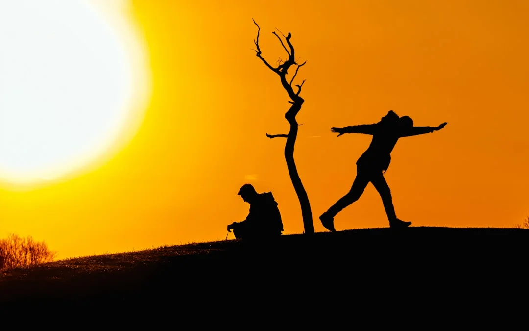 Human silhouette with luminous energy centers along the middle of the body